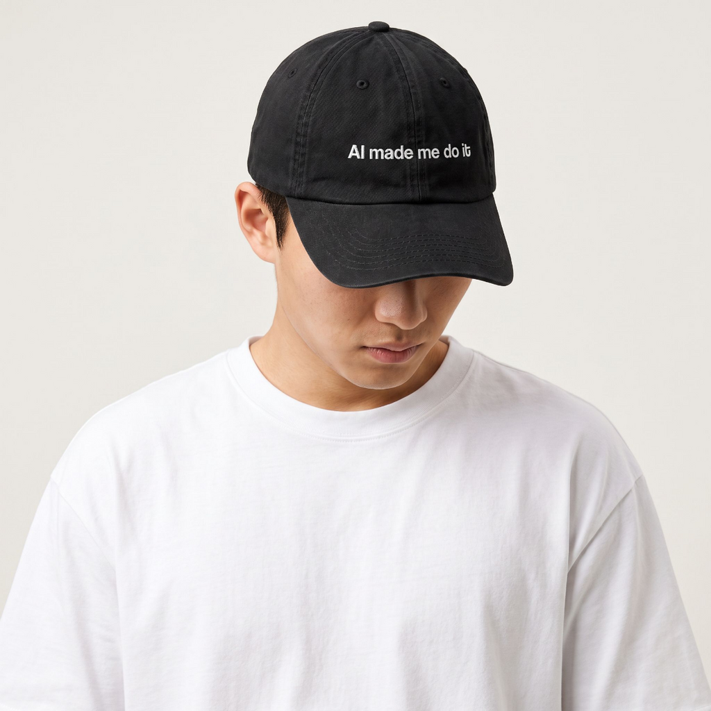 Model in a white tee wearing The HeadCount AI Made Me Do It black cap, head tilted down