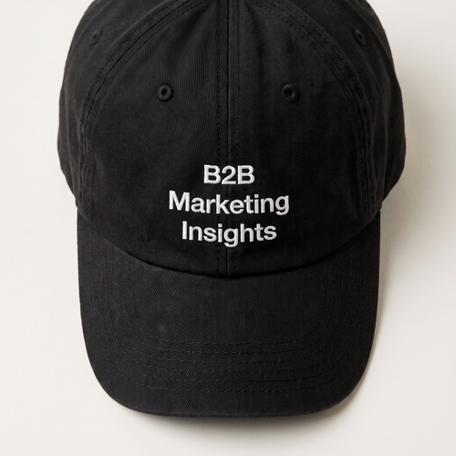 B2B Marketing Insights black cap at a three-quarter front angle against a cream backdrop