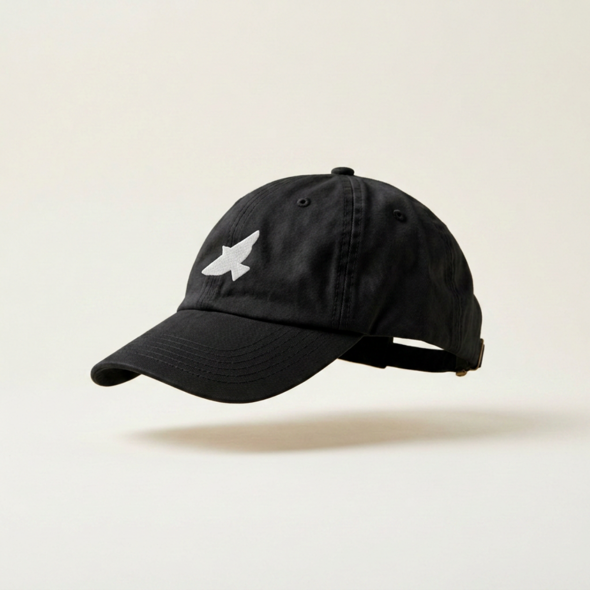 Free as a Bird embroidered black six-panel cap, side view on a white studio background