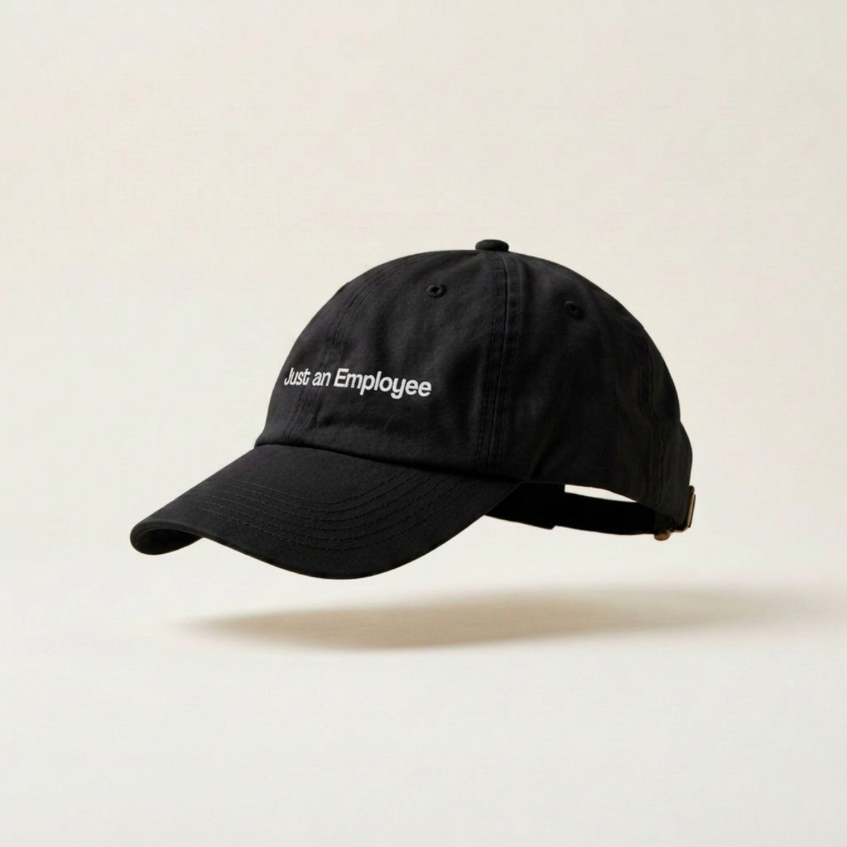 Just an Employee embroidered black six-panel baseball cap, studio side view