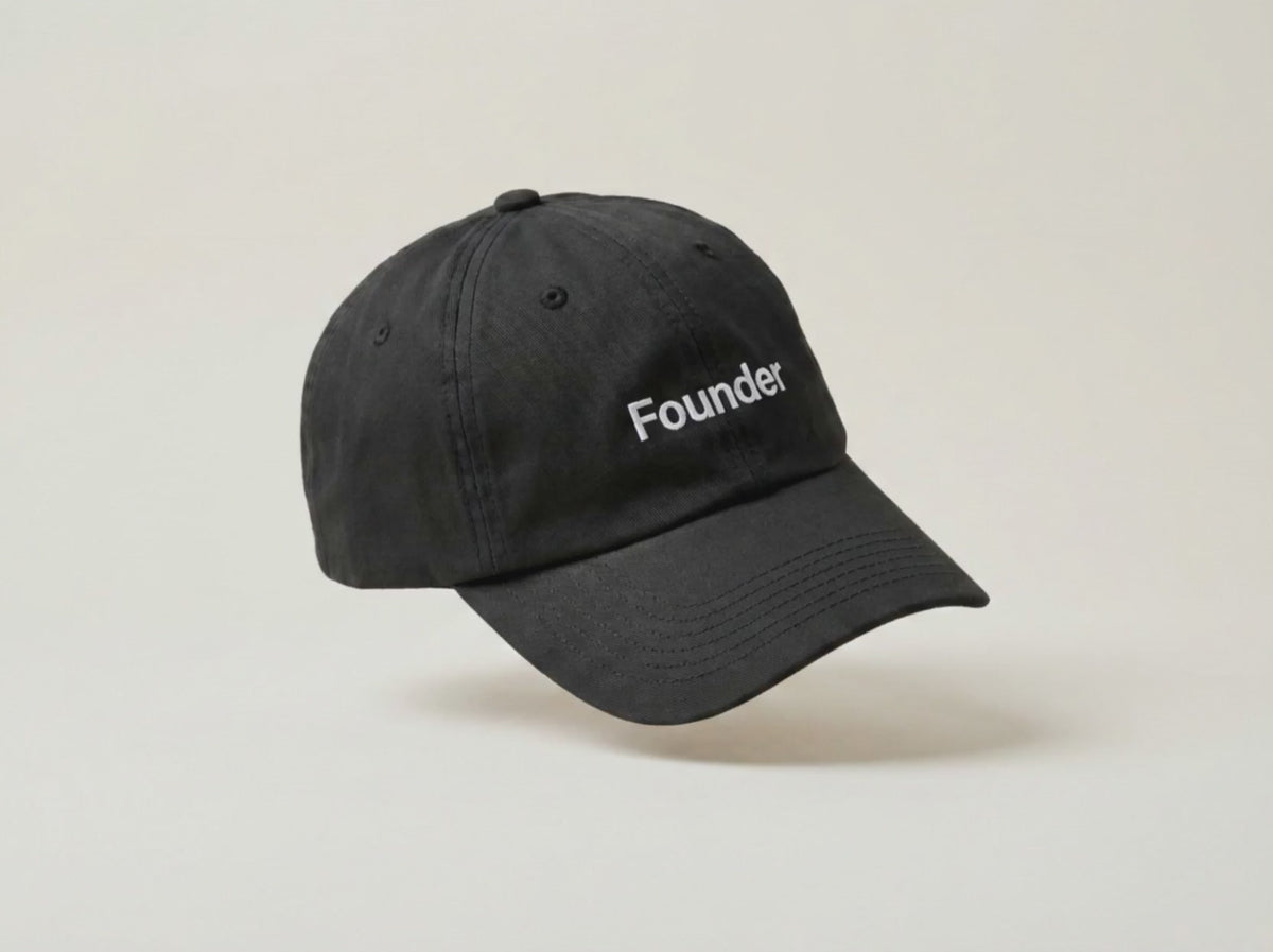Video: the Founder black cap turning slowly in profile on a cream studio backdrop